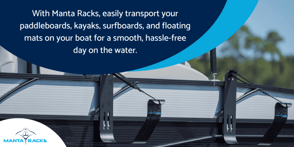 A boat displaying a sign promoting Manta Racks for easy transport of paddleboards, kayaks, and surfboards.